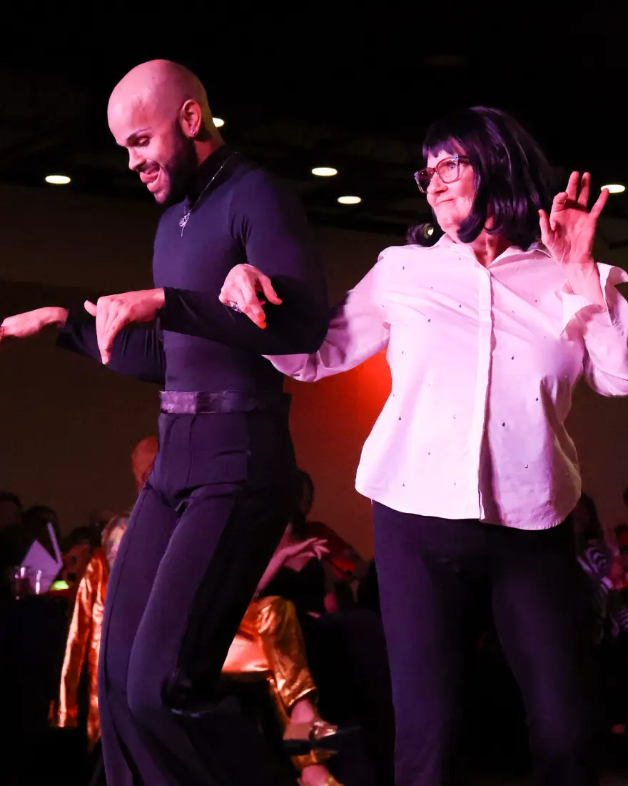 Michael dancing with a student at Effervescent Studios in Granite City