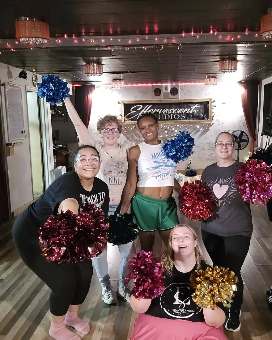 The PomSquad class together with pom-poms at Effervescent Studios in Granite City